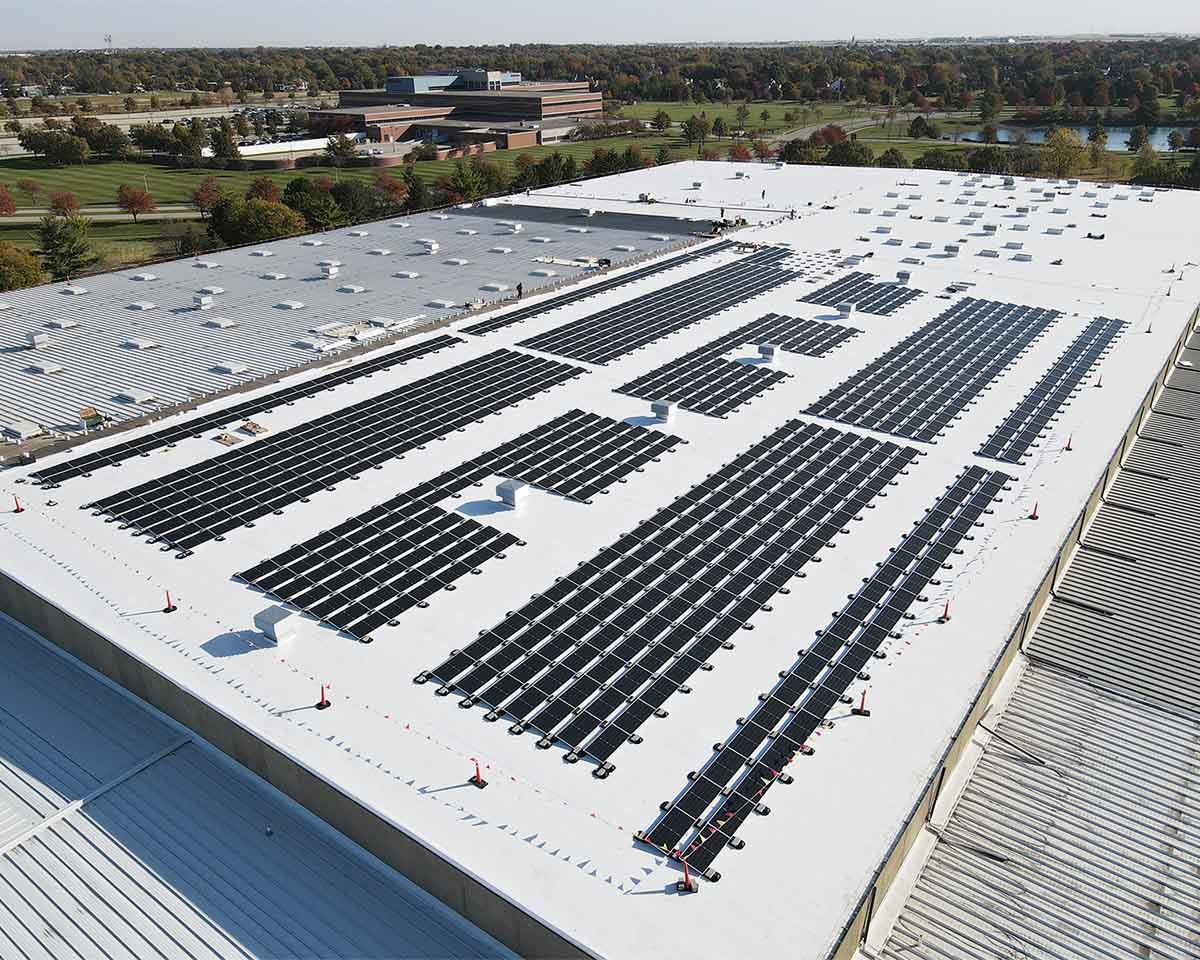 New solar panels on a rooftop of a commercial building.